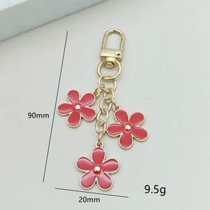 Pink floral keychain with three flowers and golden lobster clasp, 90mm total length
