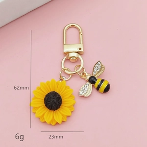 Vue détaillée du porte-clés tournesol abeille avec dimensions 62mm long et 23mm large