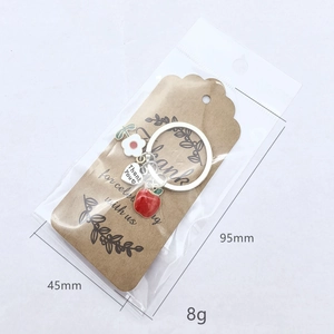 Porte-clés de remerciement avec breloque pomme rouge, fleur blanche et pendentif cœur