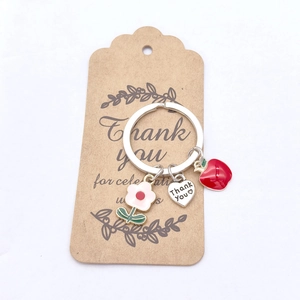 Détails du pendentif cœur Thank You, pomme rouge et fleur sur un porte-clés cadeau