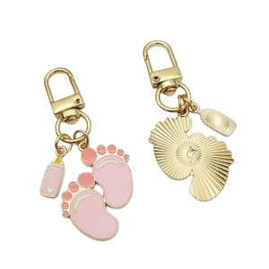 Cute pink baby footprint and milk bottle keychain with gold-plated alloy pendants