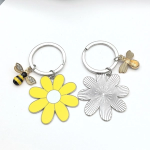 Bee and sunflower keychains set featuring yellow enamel petals and silver metal back