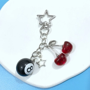 Resin cherry and black 8 ball keychain with silver star clip for handbags