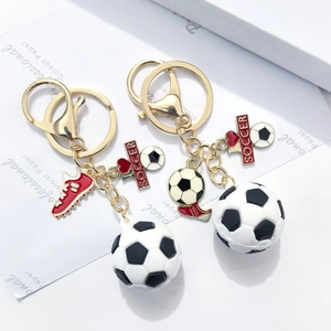 Creative 3D PVC soccer keychain set with golden alloy hook and red football shoe charm