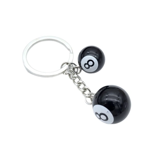 Dual resin Billiard Black 8 keychains with polished silver chain on a white background