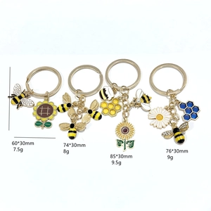 Lot de quatre porte-clés émaillés tournesol et abeille avec breloques pour sacs à main