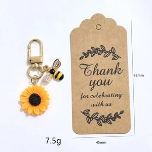 Vue détaillée du porte-clés tournesol et abeille montrant les dimensions et le poids