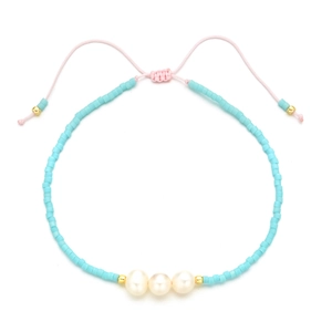 Bohemian sky blue seed bead bracelet with freshwater pearls and adjustable pink cord