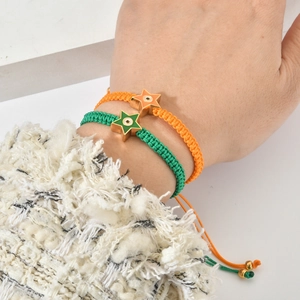 Woven star evil eye bracelet set in vibrant orange and green colors for women