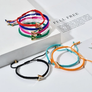 Handmade woven evil eye bracelets with golden triangle charms and colorful cord straps