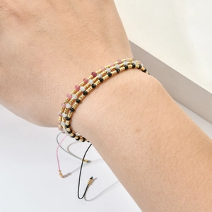 Three-piece set of stacked handmade beaded bracelets with adjustable braided ropes
