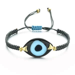 Detail of grey braided Evil Eye bracelet with blue enamel charm and adjustable gold clasp