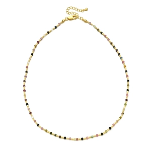 Detail of multi-color beaded necklace with faceted natural stones and gold spacer beads