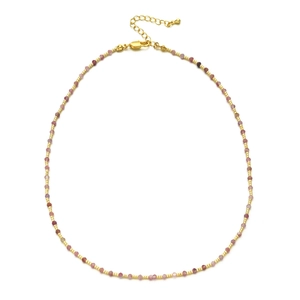 Macro detail of faceted pink quartz beads and gold spacer beads with lobster clasp