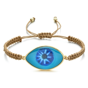 Detailed macro view of woven Evil Eye bracelet with blue eye charm and adjustable cord