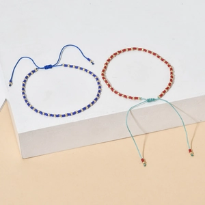 Bohemian handmade beaded bracelets with adjustable woven cords in blue and red