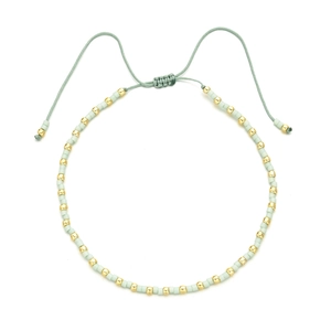 Bohemian adjustable beaded bracelet with mint green resin beads and gold accents
