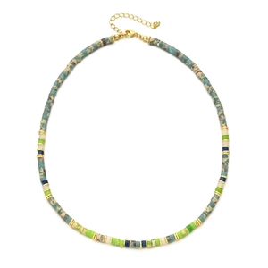 Detail of colorful stone beads necklace with gold spacers and adjustable lobster clasp closure