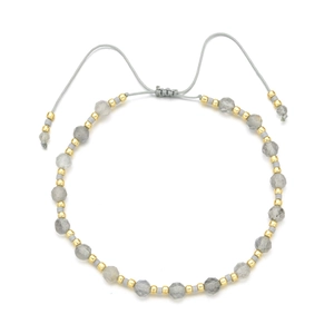 Detail of adjustable faceted grey stone bracelet with gold metal beads and sliding knot