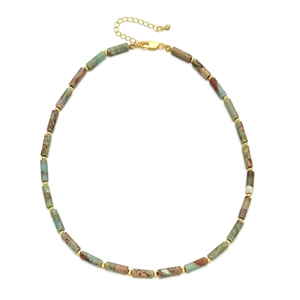 Detail view of natural stone beads and golden spacers with adjustable chain closure