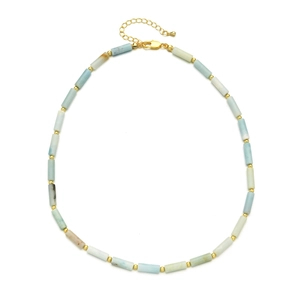 Detail of blue stone beaded necklace with golden tube spacers and lobster clasp closure