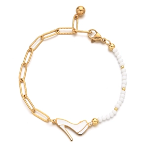 Detail of a paperclip chain bracelet with white beads and a high heel shoe pendant charm