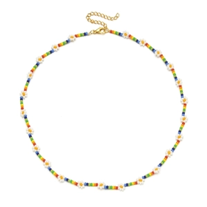 Close-up of bohemian rainbow seed bead necklace with white daisy flower charms and gold clasp