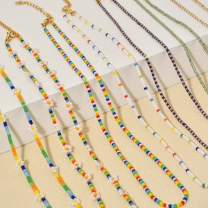 Bohemian rainbow beaded necklace set with daisy patterns and gold lobster clasps