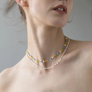 Bohemian rainbow seed bead necklace set with small white daisy flowers for women