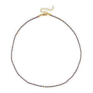 Close-up of bohemian blue and gold beaded necklace with adjustable lobster clasp and chain