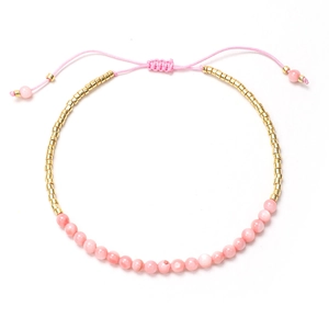 Pulsera bohemia con cuentas de cristal rosa, espaciadores dorados y cordón ajustable