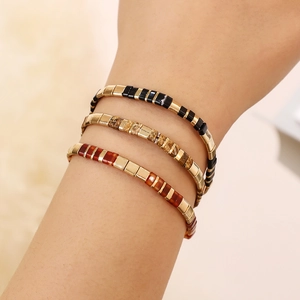 Bohemian style stackable Tila bead bracelets with gold and marble stone accents
