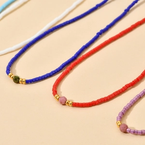 Minimalist colorful seed bead necklace with a natural stone center and gold accents