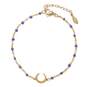 Detailed shot of golden stainless steel chain with blue beads and a crescent moon charm