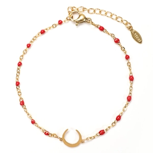Detail of gold stainless steel moon bracelet featuring red beads and lobster clasp closure