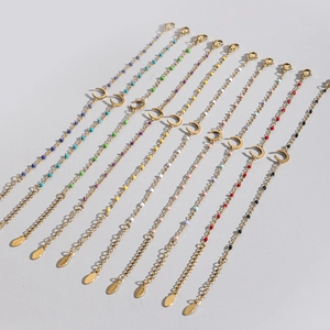 Set of minimalist gold stainless steel bracelets with colorful beads and moon charms
