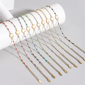 Detail view of 10-piece colorful stainless steel moon charm bead bracelet set on a white stand