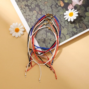 Pulseras de cruz tejidas a mano en varios colores con cierre de cordón ajustable