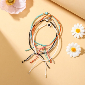 Set de pulseras de mal de ojo hechas a mano con cuentas de colores y cordón tejido ajustable