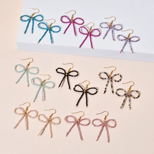 Handmade bohemian beaded bow earrings in multiple vibrant colors with gold hooks