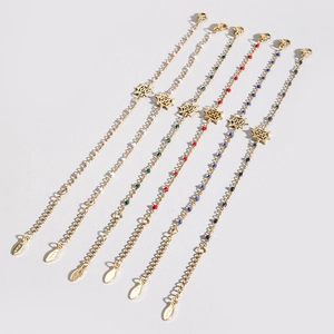 Set of six gold stainless steel beaded bracelets with spider web pendants for Halloween