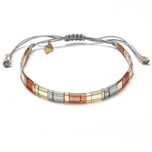 Handmade woven Tila bead bracelet with gold, silver and orange accents on grey cord