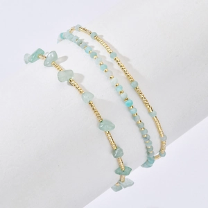 Three-piece stackable bracelet set with light green natural stones and golden beads