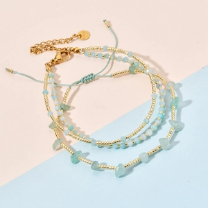 Three-layer bohemian bracelet set with gold beads, light blue seed beads and natural stones