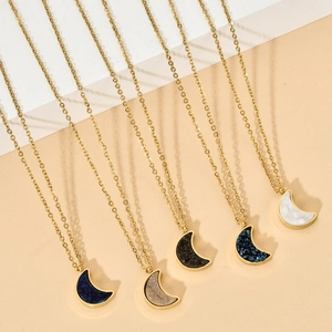 Macro detail of crescent moon druzy crystal necklaces in five colors on golden chains