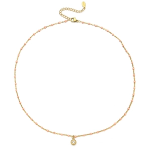 Detail van de gouden rvs ketting met roze kralen en een kristallen hanger