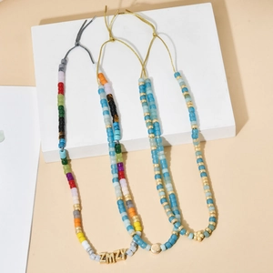 Three bohemian handmade beaded necklaces with gold accents and adjustable cords for women