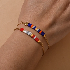Minimalist gold plated stainless steel TILA bead bracelet set worn on wrist
