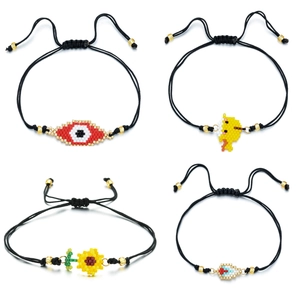 Set of four handmade beaded bracelets with evil eye, duck, and sunflower charms