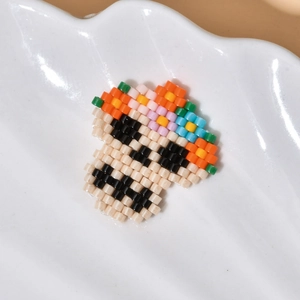 Handcrafted MIYUKI bead skull charm with floral crown for Day of the Dead jewelry DIY